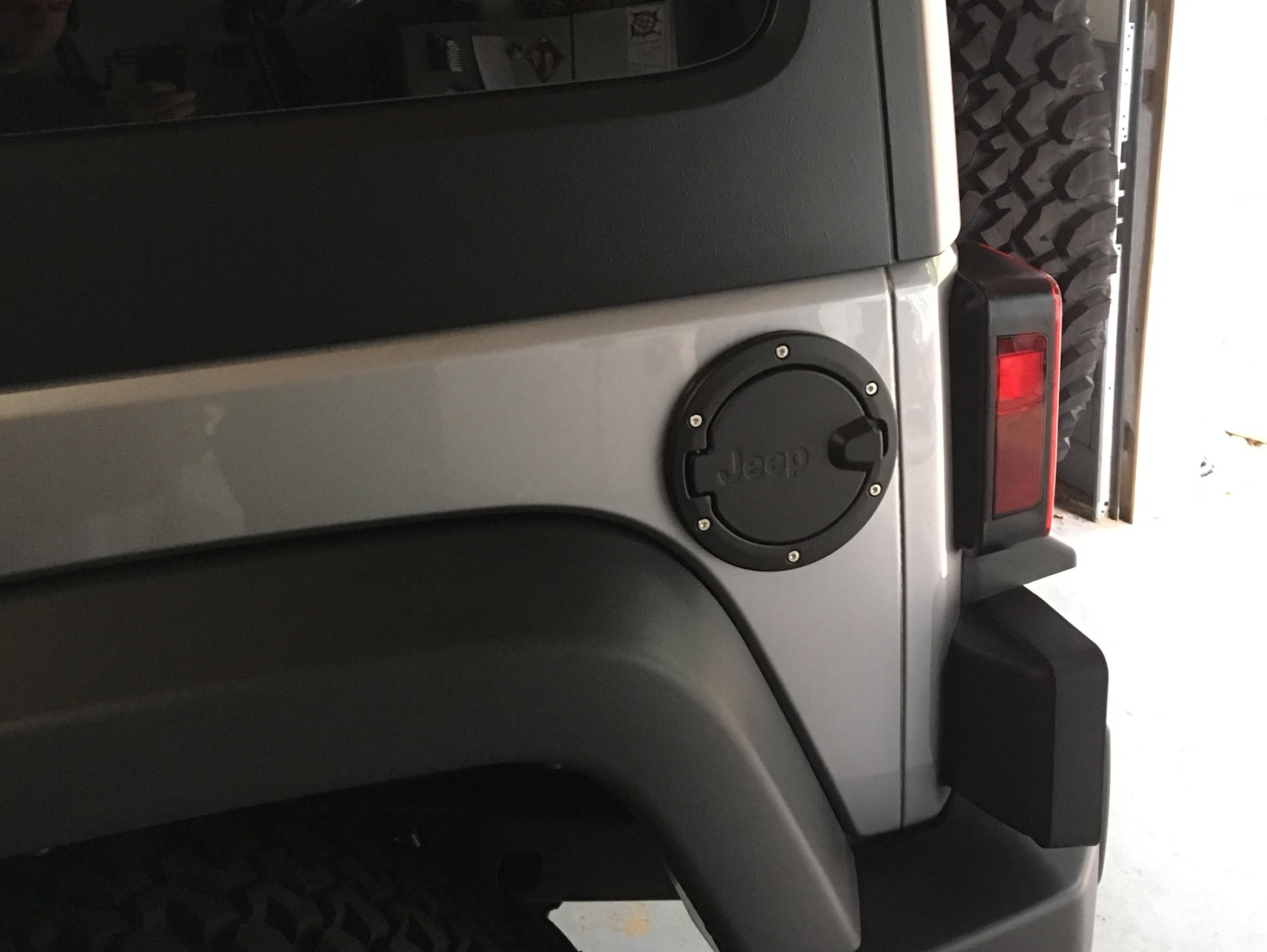 Mopar Jeep Wrangler Fuel Door with Jeep Logo; Satin Black J106916